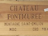 un panneau en bois sur lequel est inscrit « Château Fontumee »