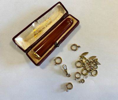 a small box with a bunch of charms inside of it