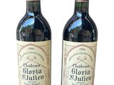 two bottles of wine sitting next to each other on a white surface