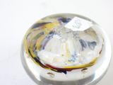a close up of a glass object with a tag on it