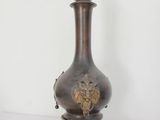 a vase that is sitting on a white table
