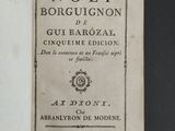 an old book with a black and white cover