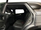 a silver truck with the door open and the passenger seat down