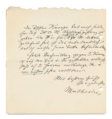 une lettre écrite à l'encre noire sur une feuille de papier