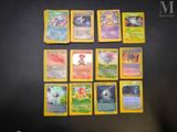 a lot of pokemon cards that are on the table