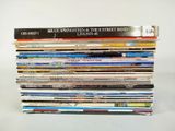 a lot of books stacked on top of each other