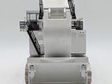 a toy bulldozer that is sitting on a white surface