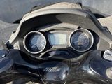 a motorcycle that is parked on the side of the road