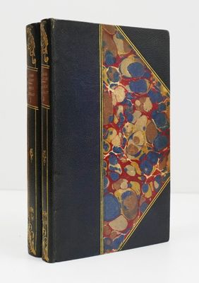 a black book with a red and blue cover and gold trim