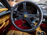 a steering wheel and dashboard of a sports car