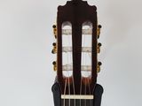 a close up of an acoustic guitar with a white background
