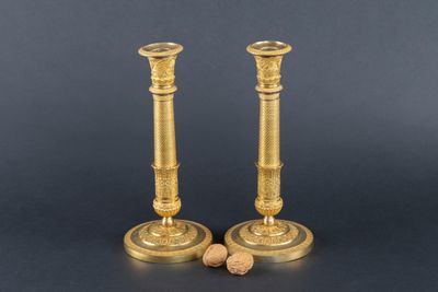 pair of antique brass candlesticks with cork stoppers