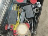 a suitcase full of assorted items sitting on the floor