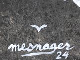 a message written on the ground with a bird flying over it