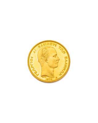 gros plan d'une pièce d'or sur fond blanc