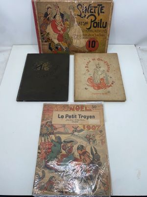 three books sitting on top of a white table next to each other
