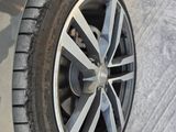 a close up of a tire on a car ' s rim