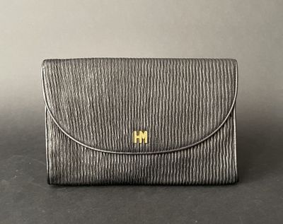 an image of a black purse with gold hardware on the front