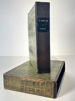 a book that is sitting on top of a book stand