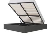 un lit noir avec un matelas blanc et un cadre noir