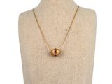 a close up of a mannequin torso with a necklace on it