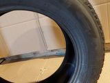 a close up of a tire on a cardboard box on a floor