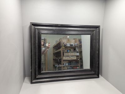 a reflection of a man taking a picture of himself in a mirror