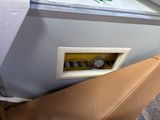 a box that is sitting on the floor next to a window