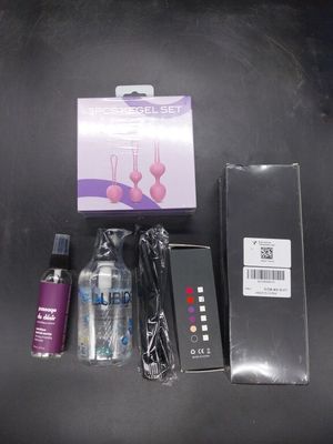 un flacon de liquide, un flacon de parfum et une boîte de produits de soins capillaires