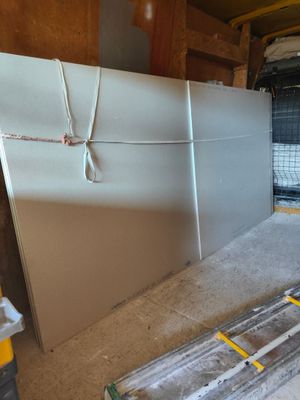 a refrigerator that is sitting in the middle of a room