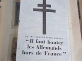 a book with a cross on it sitting on top of a table