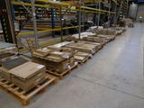 many pallets of boxes on the floor in a warehouse