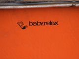 a baby relax logo on the side of a skateboard ramp