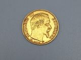 an image of a gold coin with a man ' s face on it