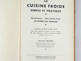 an open book on a white table with a black and white title