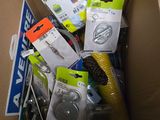 a cardboard box full of assorted items in it