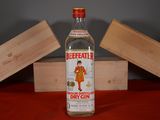 a bottle of beeffatter sitting on a table next to a wooden box