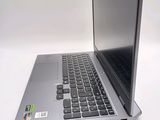 a laptop computer sitting on top of a white table