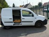 a white van with its door open in a parking lot