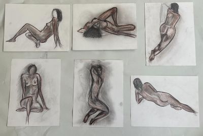 sketches of a woman sitting on a bed with her legs crossed