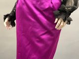 purple skirt with black blouse and black gloves on a mannequin mannequin mannequin mannequin mannequin mannequin mannequin mann