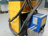 a machine that is sitting on the floor in a warehouse
