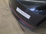a picture of a car with a sticker on it ' s bumper