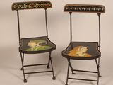 pair of folding chairs decorated with a leopard and giraffe design