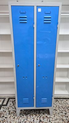 two blue lockers that are in a room