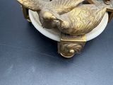 two birds that are sitting on top of a table