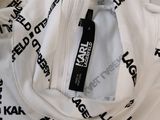 white t - shirt with black letters on it and a tag on it