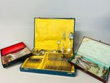a lot of silverware in a case on the table