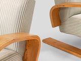 pair of mid - century modern lounge chairs with curved arms and wood frame
