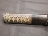 a close up of a knife on a table